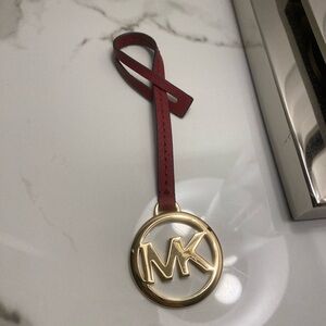 Michael Kors Gold Charm in Burgundy Leather